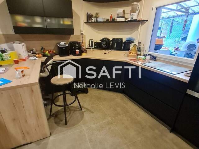 Proche de LENS, immeuble mixte rénové avec une habitation et un local commercial en activité — photo du bien