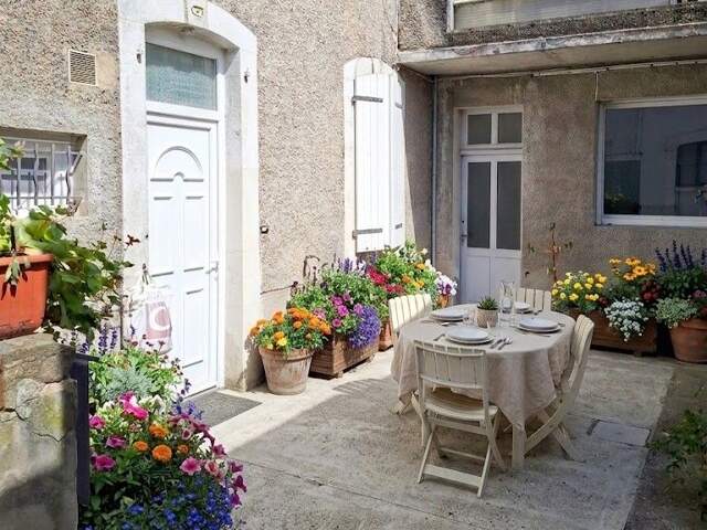 Appartement T3 en RDC avec Terrasse au Cœur de Nay — photo du bien