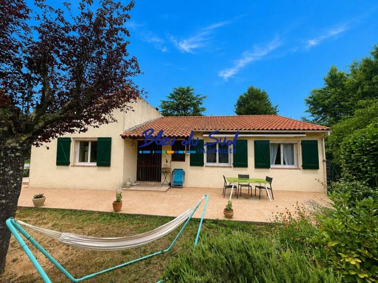 Maison 4 faces de plain pied avec jardin et garage — photo 1