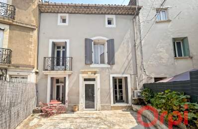 À Vendre : Authentique maison de ville avec patio, cour privative et stationnement — photo du bien