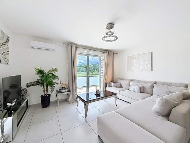 Joli Appartement T4 récent avec balcon, garage double et climatisation – ORNEX (01) — photo du bien