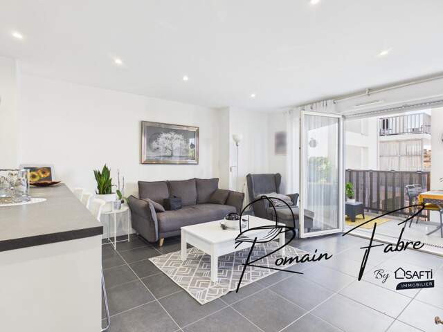 Appartement T3 avec 2 chambres et balcon dans une résidence sécurisée et arborée — photo du bien