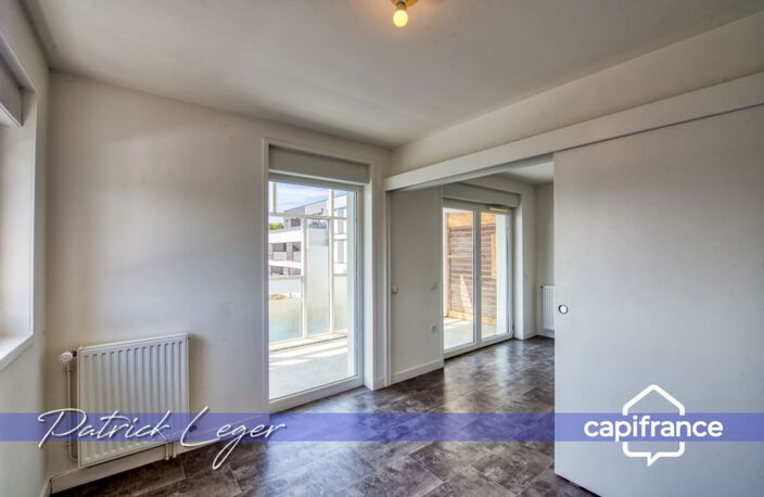 PÉRIGNY (17) – Élégant T3 modulable avec grande terrasse couverte & parking sous-sol — photo 4