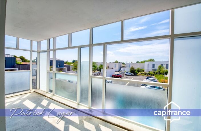 PÉRIGNY (17) – Élégant T3 modulable avec grande terrasse couverte & parking sous-sol — photo 5