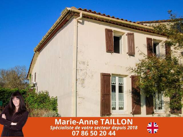 Maison de 2 chambres avec garage dans un écrin de verdure — photo du bien