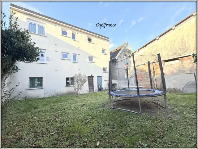 DRANCY - IMMEUBLE 2 APPARTEMENTS F3 + GARAGES + JARDIN — photo du bien
