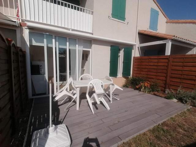 Maison dans copropriété, avec terrasse et jardinet — photo du bien
