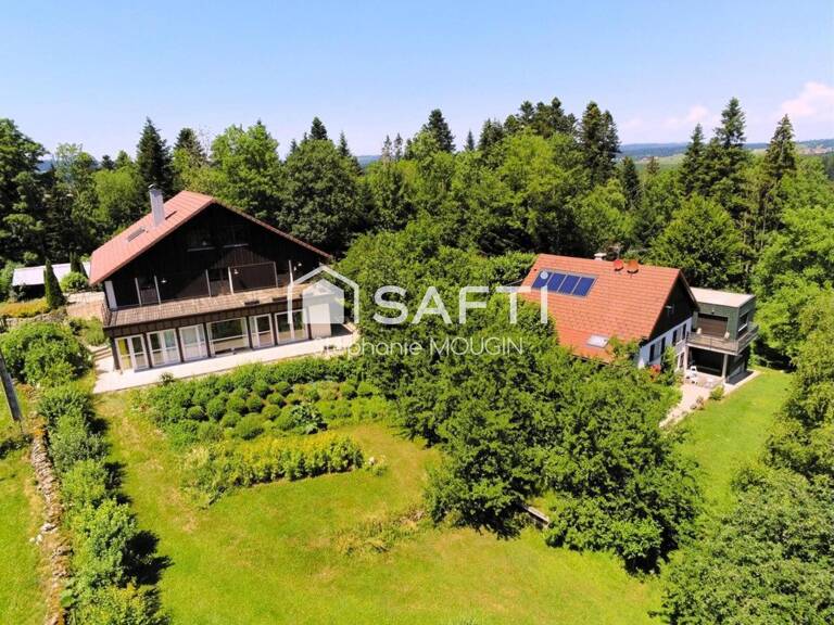 Propriété d'exception au cœur du Pays Horloger  Un domaine unique de plus de 805 m² habitables dans un ecrin de verdure. — photo 1