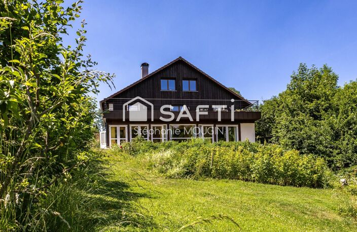Propriété d'exception au cœur du Pays Horloger  Un domaine unique de plus de 805 m² habitables dans un ecrin de verdure. — photo 2