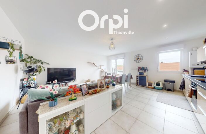 Bel appartement récent de 64m² avec balcon, deux chambres, un garage et une place de stationnement privative — photo 4