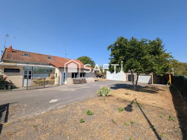 ENSEMBLE DE 2 HABITATIONS AVEC GARAGES ET JARDIN — photo du bien