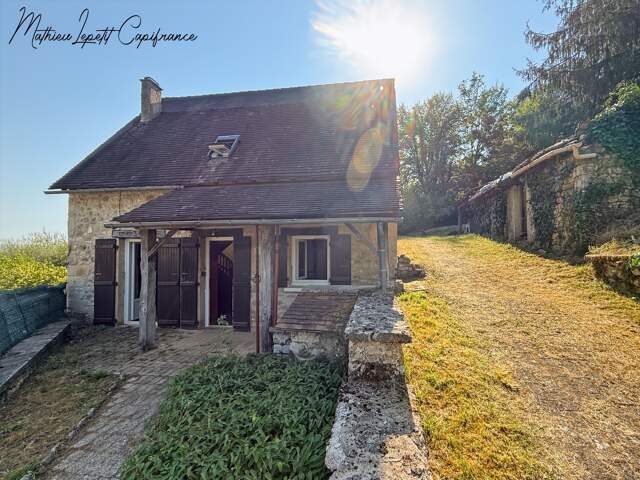 Maison en pierre apparente à vendre 3 pièces LA BACHELLERIE (24)  72 m² – 2 chambres – terrain 1744 M² — photo du bien