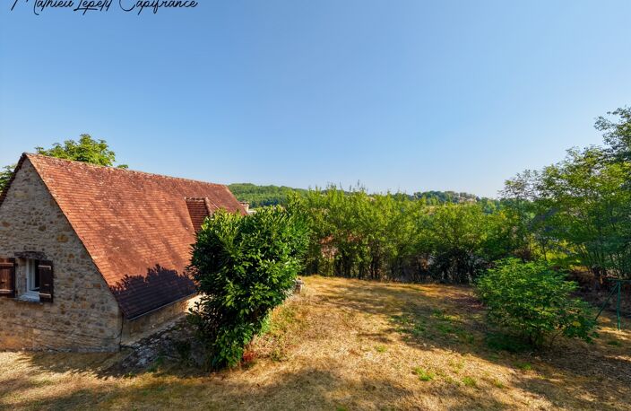 Maison en pierre apparente à vendre 3 pièces LA BACHELLERIE (24)  72 m² – 2 chambres – terrain 1744 M² — photo 2