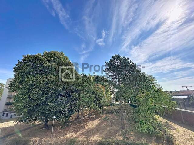 APPARTEMENT F4 TRAVERSANT AVEC BALCON, BOX ET CAVE — photo du bien