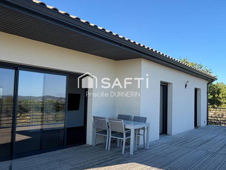 Maison de plain-pied - Vue - Terrain - Garage — photo 1