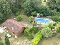 MAISON OSSATURE BOIS DANS SON ECRIN DE VERDURE — photo 2
