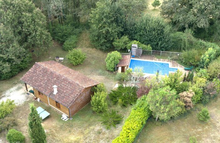 MAISON OSSATURE BOIS DANS SON ECRIN DE VERDURE — photo 2