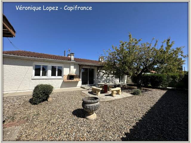 Le Passage, maison de plain-pied de 93m² avec garage, jardin et abri en dur — photo du bien
