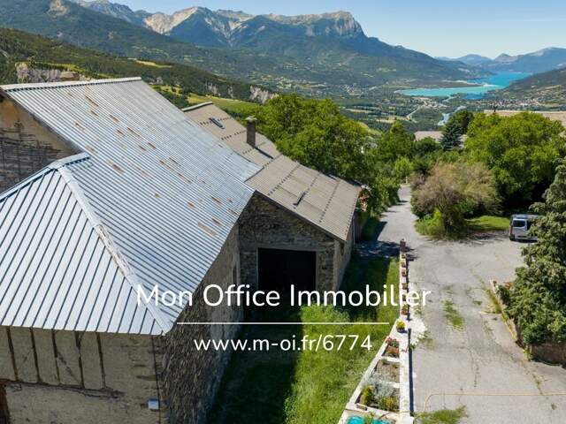 Référence : 6774-MTE - Bâtisse à rénover 150m² - orientée sud- vue Lac — photo du bien