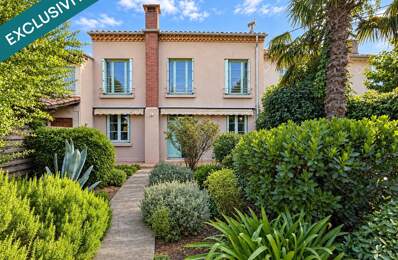 Le charme des années 60, le confort d'aujourd'hui et la douceur d'un jardin secret : la maison familiale par excellence — photo du bien