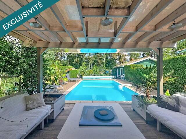 Maison avec piscine, sauna et terrain arboré — photo du bien
