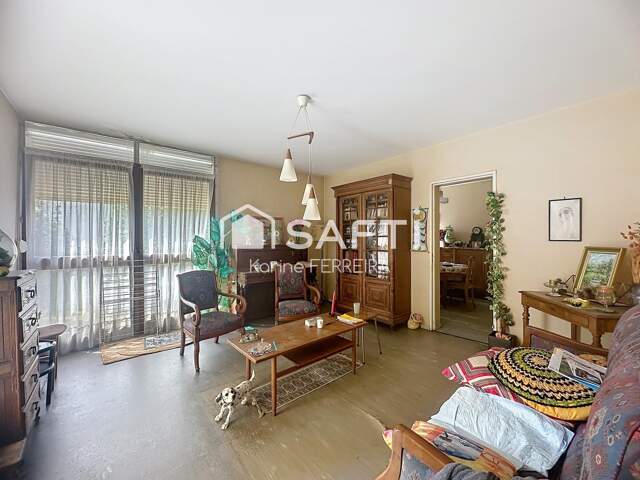 Appartement 3 pièces de 58 m² à rénover avec balcon, cave et stationnement — photo du bien