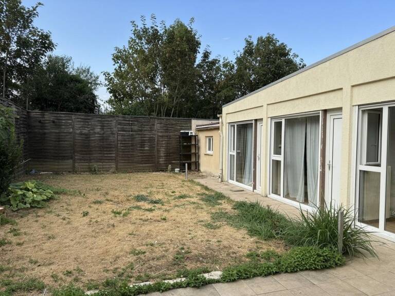 Maison 108 m²  4 chambres  Jardin  Box  Grigny — photo 1