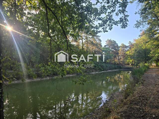 Terrain de loisir avec petit étang de -1 000 m² — photo du bien