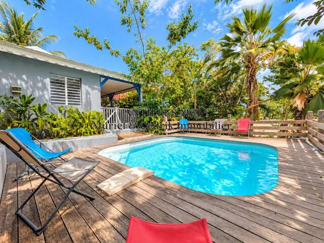 Un cocon tropical avec piscine, proche de tout — photo du bien
