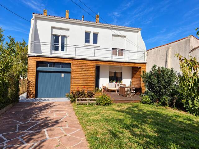 Maison individuelle avec jardin et garage proche centre-ville — photo du bien