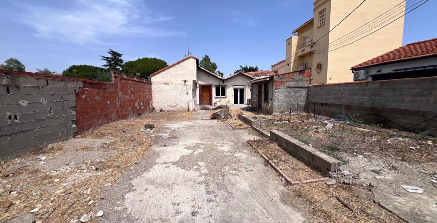 Maison de plain-pied de 95 m² environs avec travaux à prévoir sur un terrain de 509 m² proche de l'aéroport — photo 1