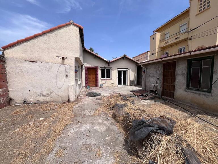 Maison de plain-pied de 95 m² environs avec travaux à prévoir sur un terrain de 509 m² proche de l'aéroport — photo 1