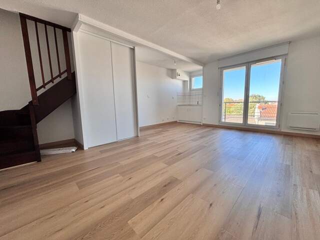 Duplex en dernier étage avec terrasse et parking boxé — photo du bien