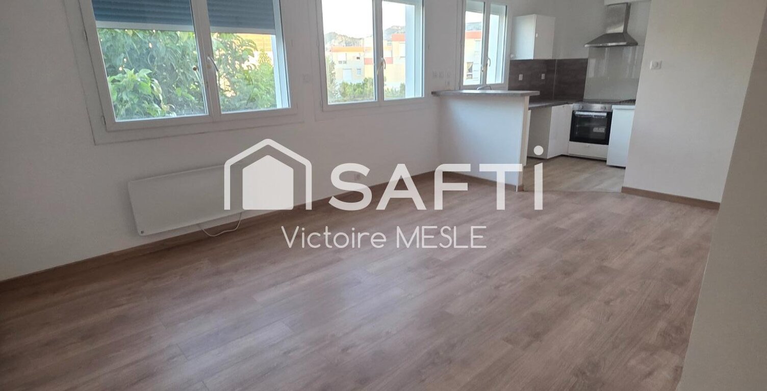 Joli Appartement d'une superficie de 49 m 2, offrant un un salon de 26 m2 ouvert sur un espace cuisine équipée, avec place de parking, dans une résidence calme du 8ème arrondissement de Marseille, quartier Bonneveine. — photo 1