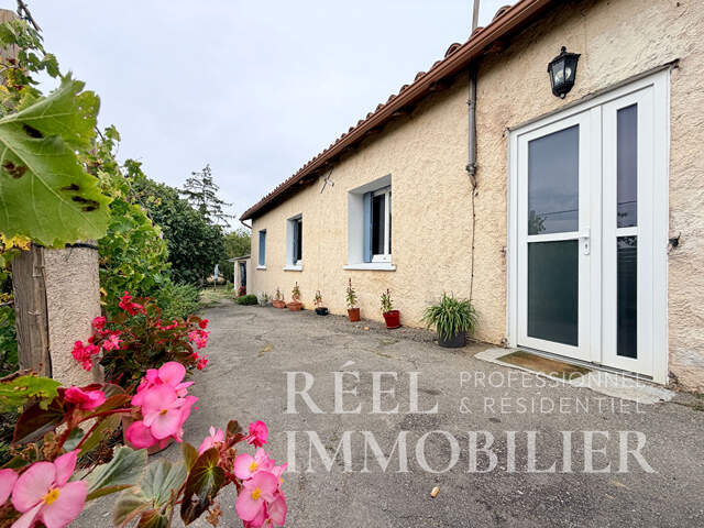 Maison de 80m2 avec grand terrain et 2 garages — photo du bien