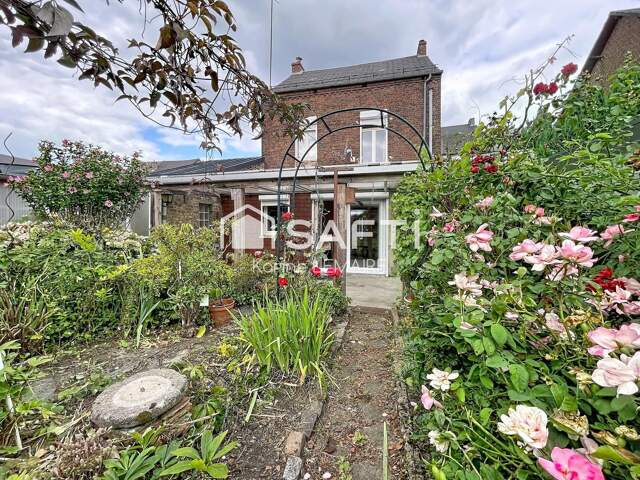 Beau potentiel pour cette maison avec garage et beau jardin — photo du bien
