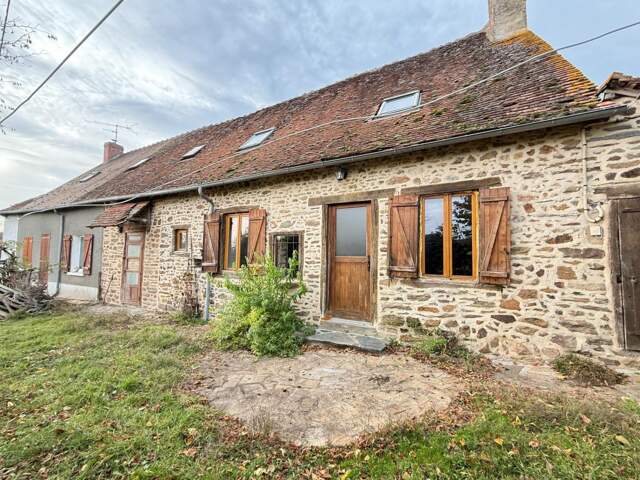 Ensemble de 2 maisons mitoyennes en pierre 209m² + grange, terrain 2000m² 79 500 € — photo du bien