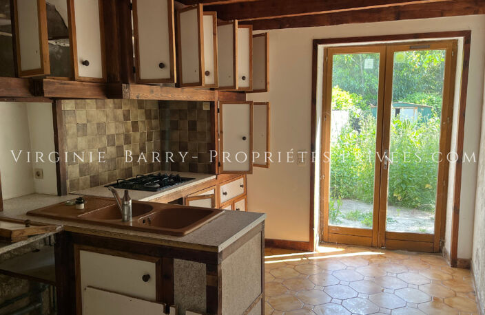 IMMEUBLE COMPOSE DE 4 APPARTEMENTS ET 1 MAISON AVEC JARDIN — photo 4