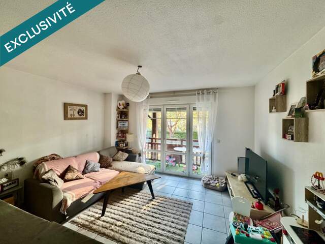 Appartement T3 de 54 m² avec un balcon et deux places de parking — photo du bien