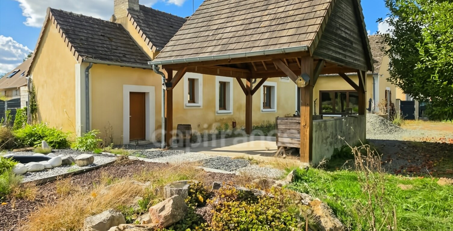 Du charme, de beaux volumes de plain-pied et un jardin arboré : découvrez cette maison pleine de potentiel — photo 1