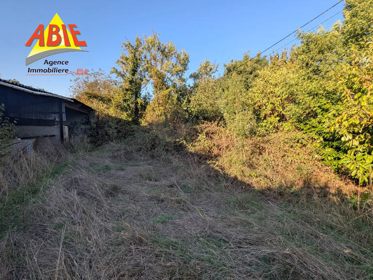 BESSINES beau terrain de 1200 m2 avec hangar — photo 1