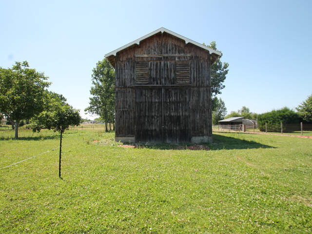 Ancien séchoir à tabac – 83 m² – Terrain de 5 428 m² – Potentiel de réhabilitation en habitation proche de CASTELJALOUX (47) — photo du bien