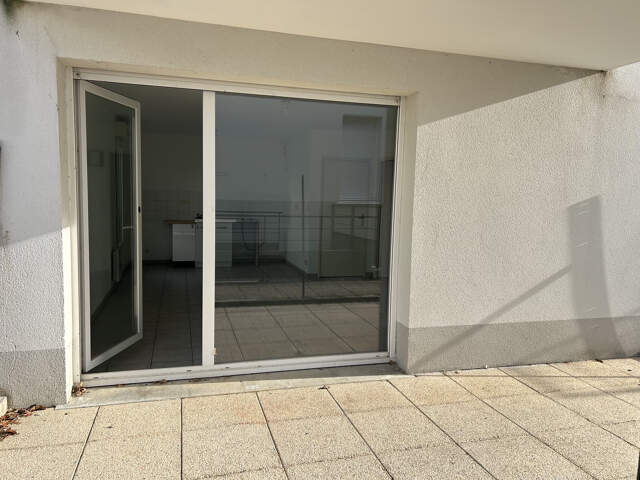 Appartement T2 RDC avec place de parking sécurisée — photo du bien