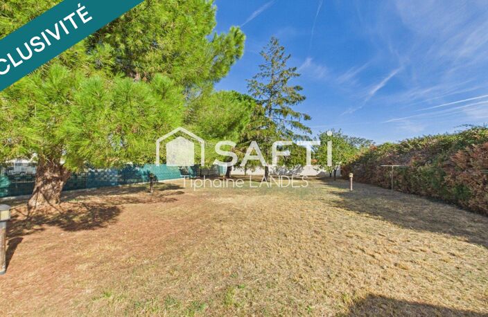 Maison de plain-pied avec jardin arboré et garage — photo 3