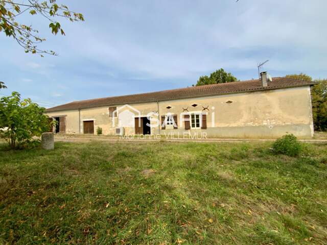 A Vianne, maison en pierre de plain pied, de 125 m² habitables avec dépendances sur un terrain de 9115 m² — photo du bien