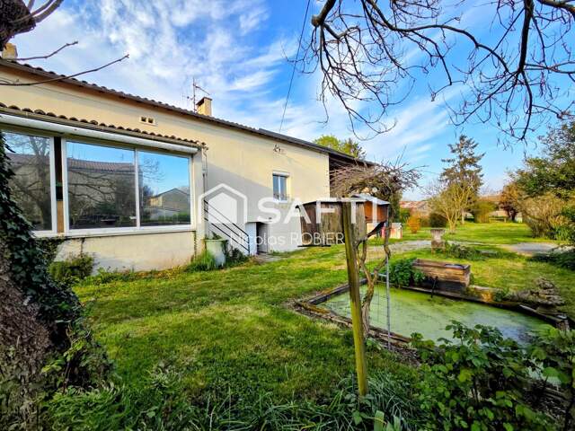 Maison en pierre autonome en énergie !! Garage, dépendances, jardin ! Parcelle constructible à revendre ! — photo du bien