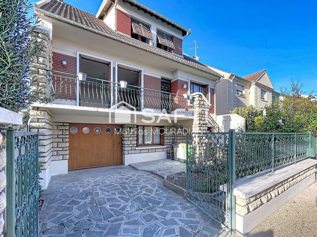 Maison avec jardin et garage à 2 pas du RER D. — photo du bien