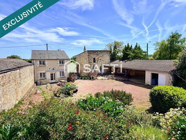 ENSEMBLE IMMOBILIER COMPOSÉ DE 2 MAISONS, CAVE, GARAGE ET JARDIN CLOS — photo du bien