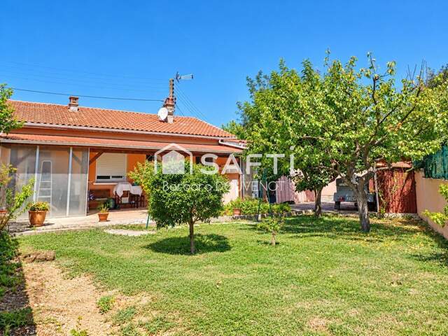 Maison de plain pied de 75 m² sur 310 m² - 2 chambres + 1 bureau, terrasse couverte, jardin arboré, dépendances. — photo du bien