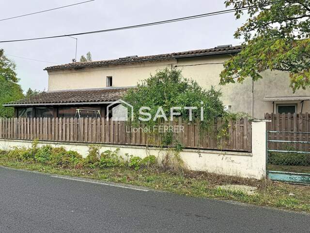 Maison de 100m², avec petit jardin et véranda. — photo du bien